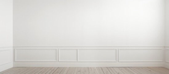 A vacant space with white walls, wooden flooring, and a door to another room.