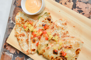 Enjoy the taste of a quesadilla filled with delicious vegetable sauce