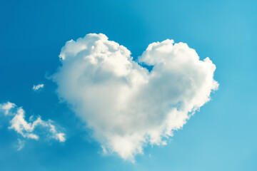 white cloud in heart shape on blue sky for love or valentine's day concept