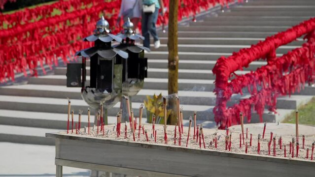 Close-up candles on background Naga King with Buddha statue Beautiful Naga statue, Wat Tham Jang, New landmark, Phetchaburi Province Invisible Thailand