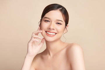 Beautiful smile of young asian woman with healthy white teeth on beige background, Dental care. Dentistry concept.