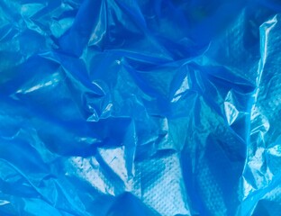 Blue crumpled plastic bag, creative art background
