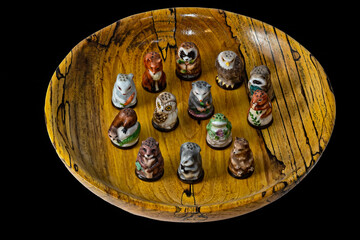 Animal shaped thimbles in wood bowl