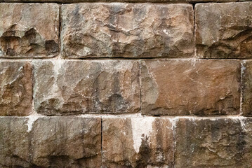 natural brown aged stone wall exterior texture background