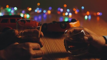 Drinking and drive, man hands down alcohol and lifts car key.