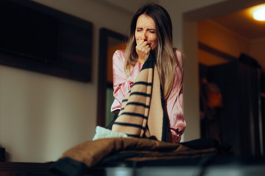 Woman Packing her Bags Leaving her Marriage and Husband. Unhappy wife making an emotional decision of separation and independent life 
