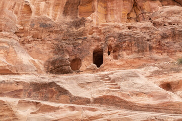 Pagan Nabatean altar carved into the wall at the beginning of the gorge Al Siq in the Nabatean...