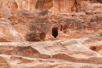 Pagan Nabatean altar carved into the wall at the beginning of the gorge Al Siq in the Nabatean kingdom of Petra in Wadi Musa city in Jordan