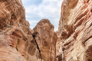 The beauty of high mountains at beginning of the gorge Al Siq in Nabatean kingdom of Petra in Wadi Musa city in Jordan