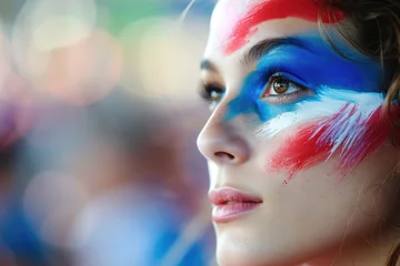Selbstklebende Fototapeten woman watching the 2024 olympic summer games wearing makeup in the color of the french flag © Salander Studio