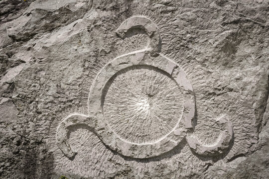 Solar sign on the stone as a symbol of the Ingush people, Ingushetia Republic of Russia