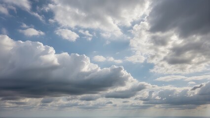 Fototapeta premium A Captivating Sky Photo Immersed in Cloudy or Overcast Colors. Witness the Subtle Beauty of Gray and White Tones as Clouds Paint the Sky, Creating a Diffuse, Muted Light.