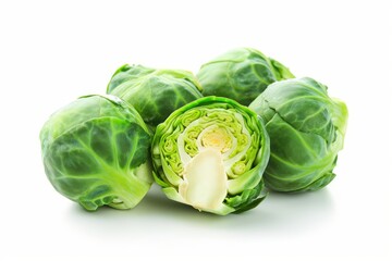 Fototapeta premium Brussels Sprouts with One Cut in Half on White Background