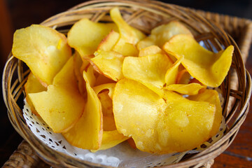 Cassava chips snack on wooden table
