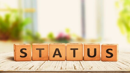 Status sign made of wood on a table.