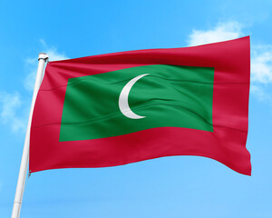 Maldives flag fluttering in the wind on sky.