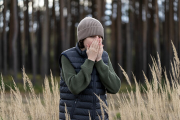 Portrait of a teenager against a background of nature.