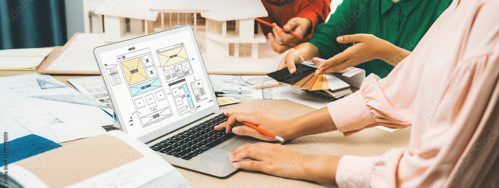 Poster cropped image of interior designer team discuss the material color while laptop displayed website wi