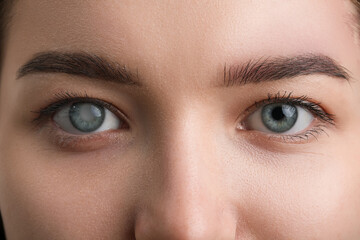 Young woman with blue eyes, closeup