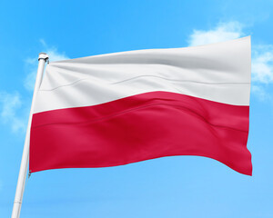 Poland flag fluttering in the wind on sky.
