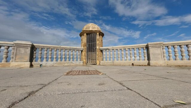 Garita watch tower under blue sky on a sunny day at the coast of Cadiz city, Spain
