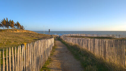 Fototapeta na wymiar Path way sand along the Atlantic Ocean beach on the Sables d'Olonne coast