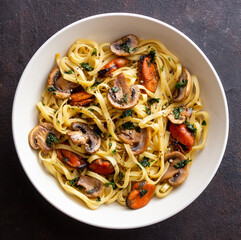 Tagliatelle pasta with mussels and mushrooms. Italian cuisine. Seafood.
