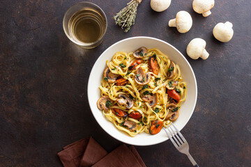 Tagliatelle pasta with mussels and mushrooms. Italian cuisine. Seafood.