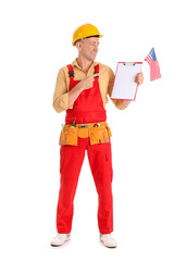 Mature worker pointing at USA flag and clipboard on white background. Labor Day celebration