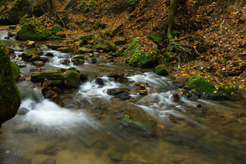 Tiny river called Schwarze Ernz near the waterfall Schiessentuempel in Luxembourg