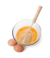 Beaten eggs and whisk in glass bowl isolated on white