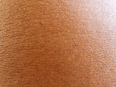 abstract and blurred human skin surface close up. brown skin, or Asian skin.
