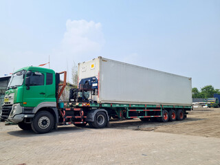 portable generator on 40 feet trailer truck. generator for refrigeration engine needs for refrigerated container transportation.