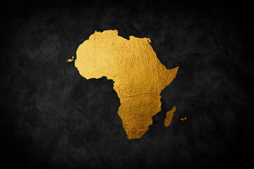 Africa continent shaped from golden glitter on a black background.