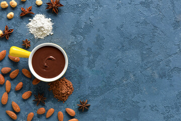 Composition with tasty melted chocolate on blue background