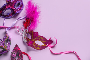 Carnival masks on lilac background