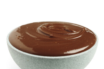 Bowl of tasty melted chocolate on white background