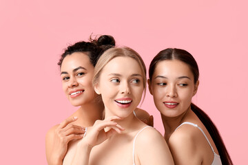 Pretty young women on pink background