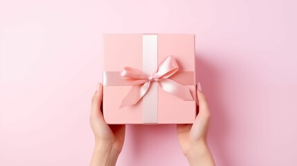 Hand open present gift box on pastel pink background