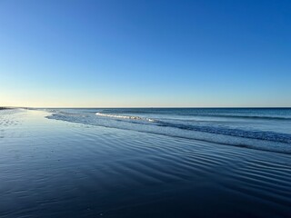 Blue seascape background, clear blue sky and blue sea horizon
