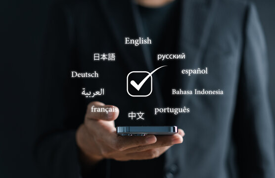 Businessman using  translation or translate on the mobile app worldwide language conversation speaking concept...