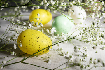 Springtime celebration, Easter eggs with flowers on wooden backdrop, holiday decor