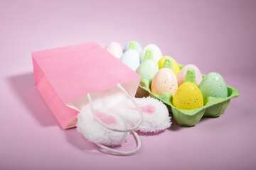 bunny ears in a shopping bag, Easter egg discounts, Pink background, festive spring shopping