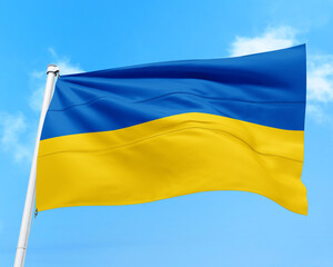 Ukraine flag fluttering in the wind on sky.