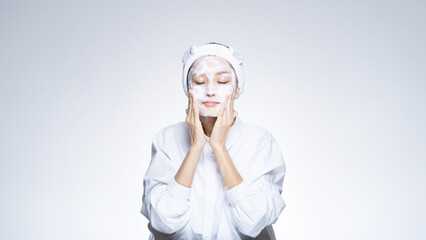 Young beautiful Asian woman with healthy fresh skin wearing white clothes on neutral background, skin care, cosmetology, beauty and spa, Asian woman portrait