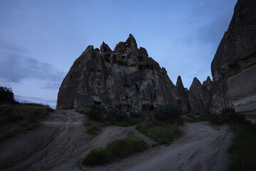 Valley with cave houses in cappadocia in the evening