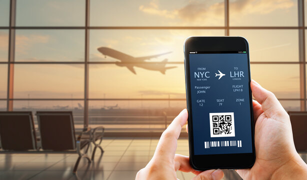 Man hands showing electronic boarding pass,plane ticket on blurred airport as background - Powered by Adobe