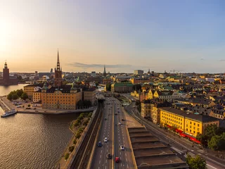 Foto op Canvas The main central road through Stockkholm central city, passing near the old Town and Riddarholmen. The district of Södermalm above. Drone view, late august. © John