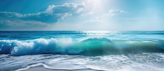 Beautiful ocean waves under a clear, sunny sky