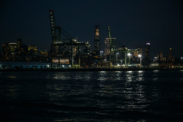 Fototapeta na wymiar Brooklyn harbor at night from Hudson bay, Red Hook, New York
